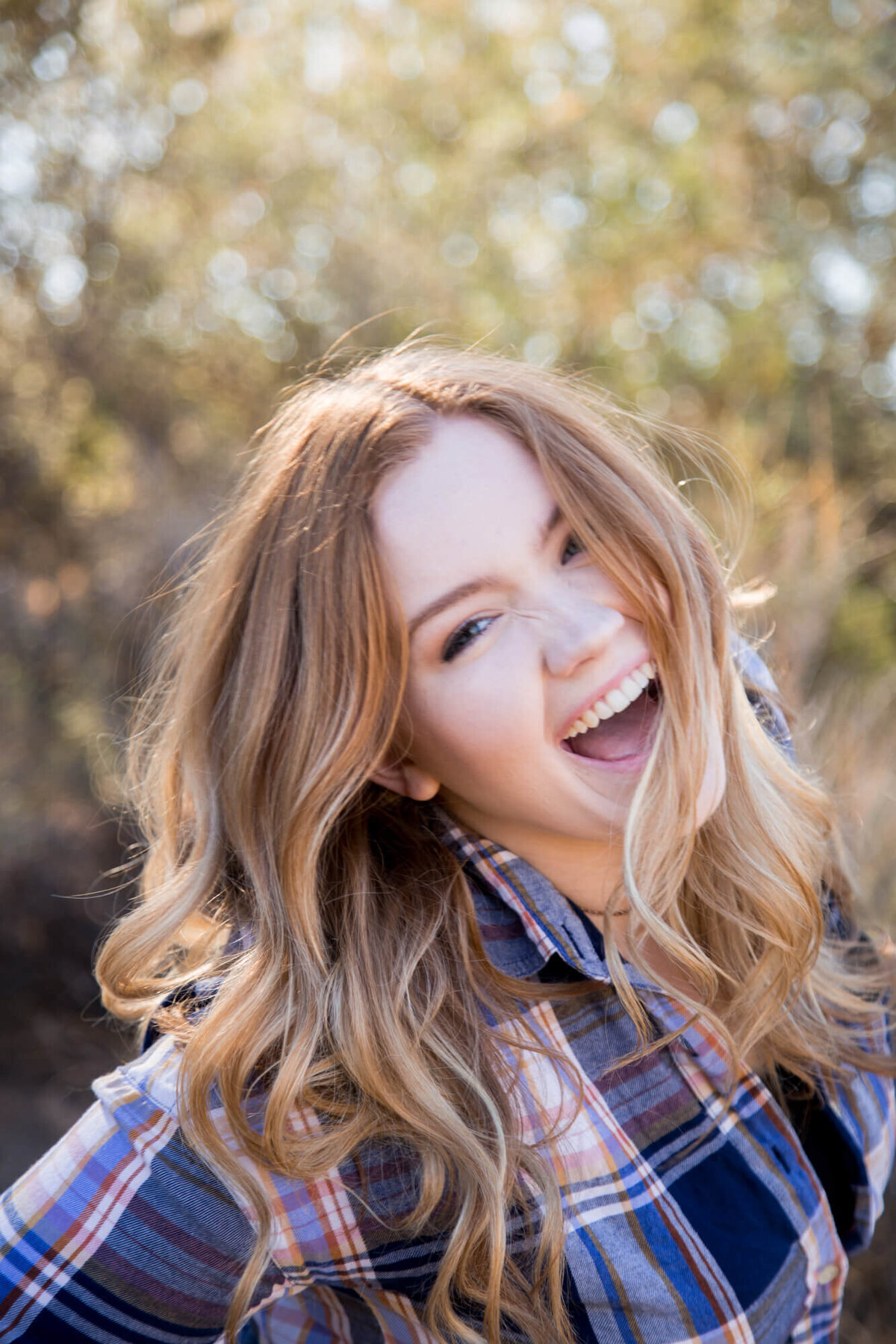 laughing young woman with red hair