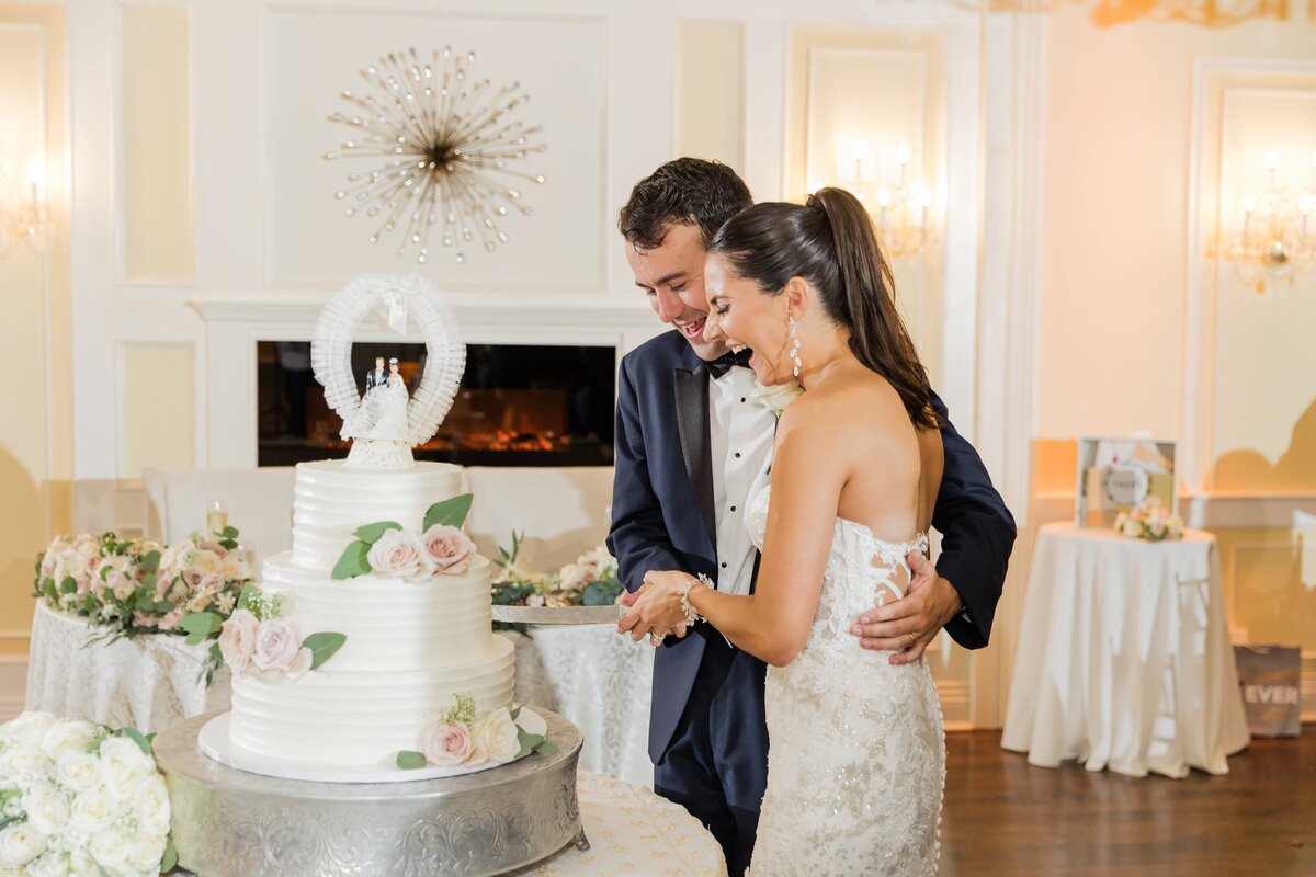 Bride and groom cutting cake  at New York wedding