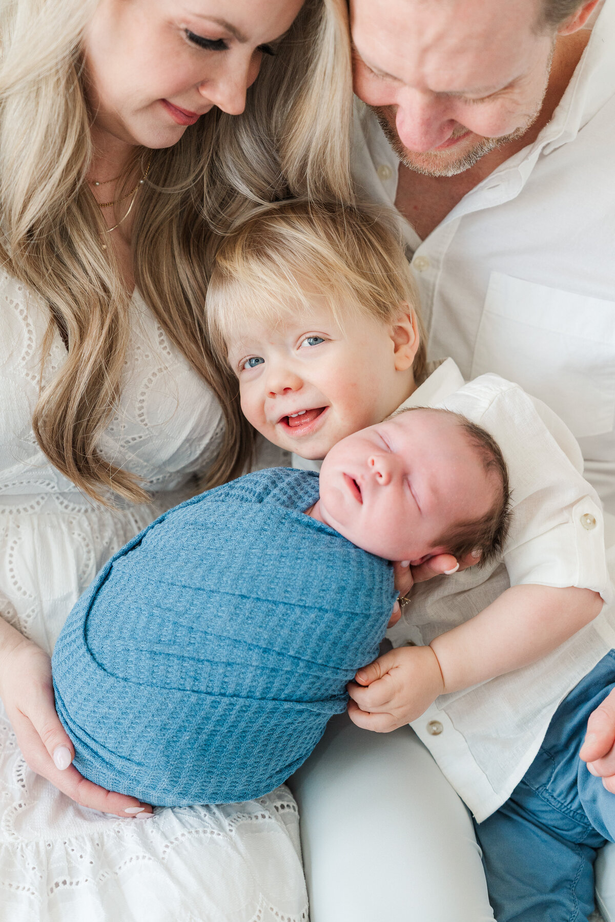 Light and neutral baby boy in home lifestyle newborn photos colorado elena spraguer photography 0026