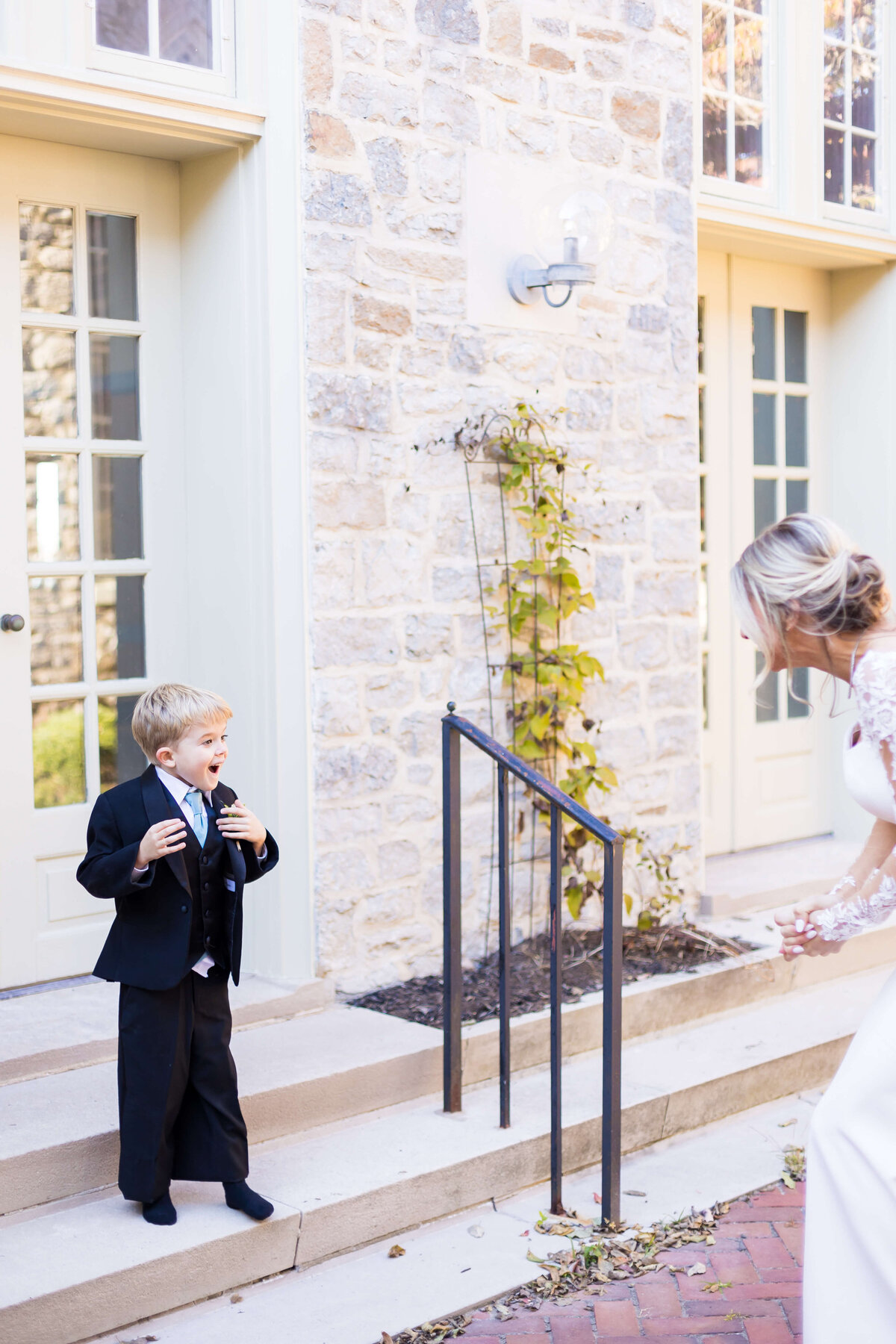 Little boy in black suit at The Carrick House Wedding venue in Lexington, KY