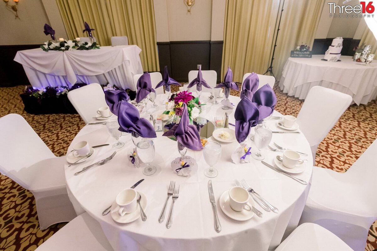 Purple and White table setup for wedding reception