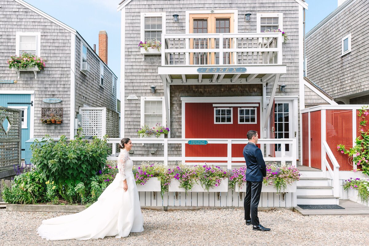 bride walks up to groom during their first look in nantucket