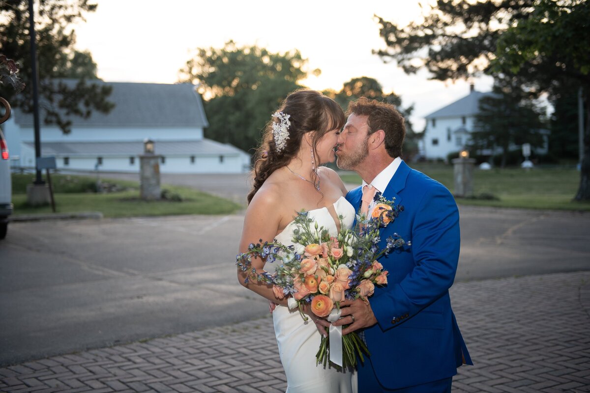 Groom adjusting cufflinks in mirror