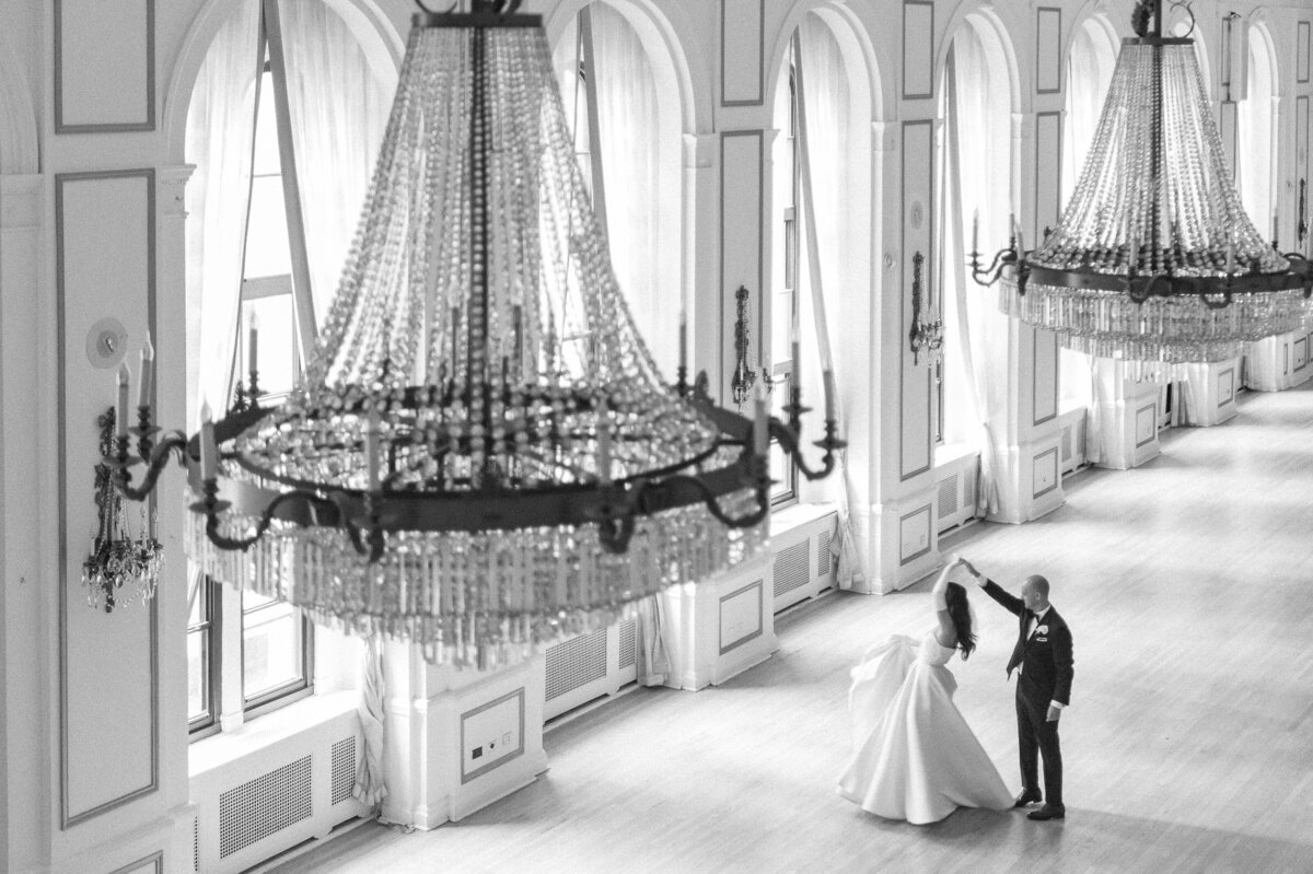 Arial shot of a couple in black and white while they dance at the Fairmont Royal York Hotel