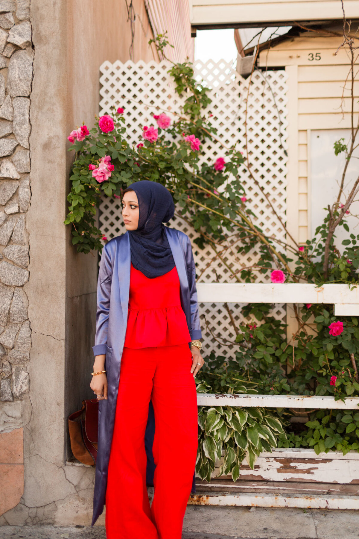 Experience the allure of bold elegance as Maryam graces the frame in a striking red jumpsuit and a flowing blue silk robe, captured against a captivating backdrop by Lauren Duffy Photography. This portrait, rich in color and style, invites you into a world where vibrancy meets grace. Lauren Duffy's lens skillfully frames Maryam in a scene that transcends fashion, creating a captivating narrative. Explore the artistry that defines Lauren Duffy Photography, where every portrait becomes a unique story, beautifully told through the lens of elegance and individuality.