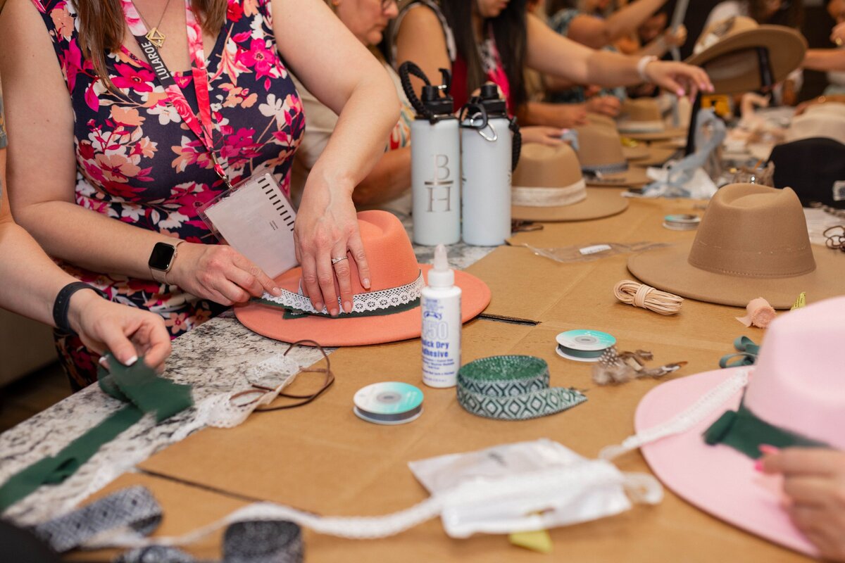 group of women working on a craft at a table