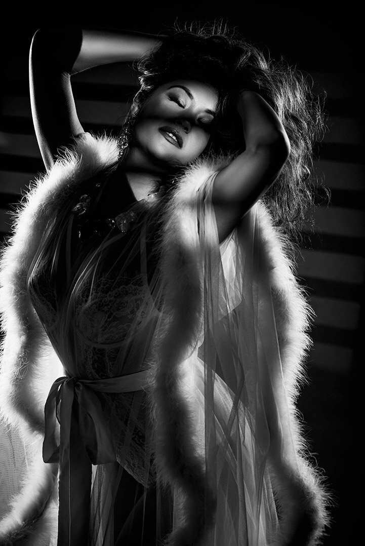 Dramatic black and white boudoir photo of a woman in a Catherine D'lish robe with Old Hollywood Glam and GOBO blinds lighting.