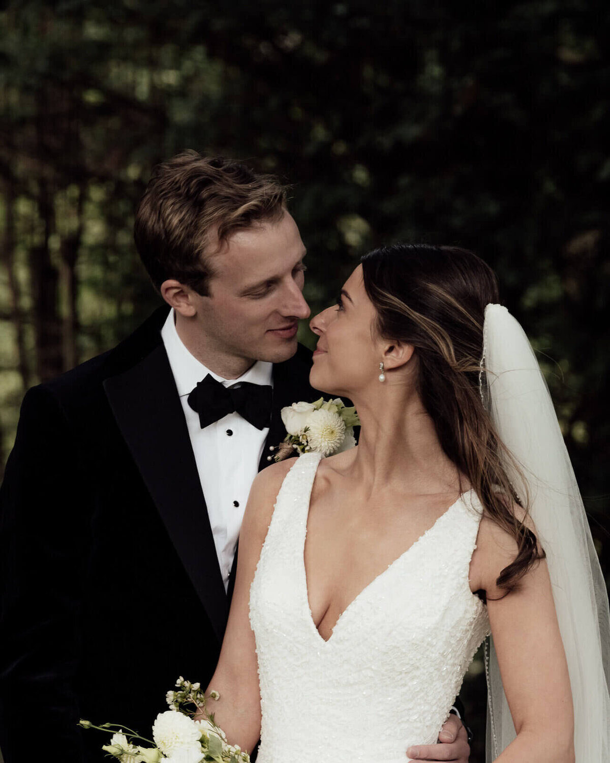 A romantic image as a couple gaze into each others eyes as they start to kiss.