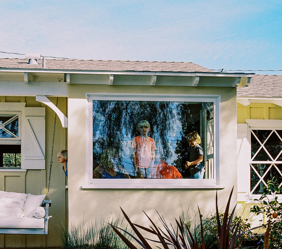 california kids look out bay window