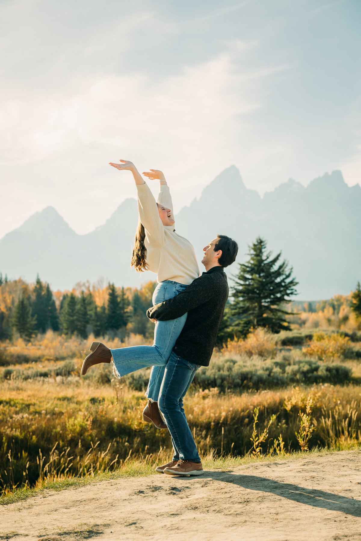 Schwabacher's Landing couple session at Jackson Hole photo session for engaged couples with fall colors and cozy outfits