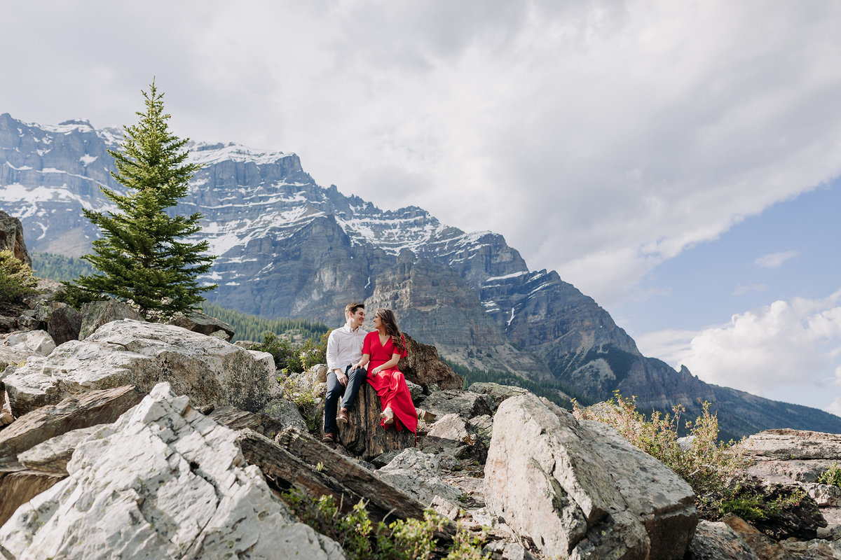epic moraine lake mountain engagement session red dress