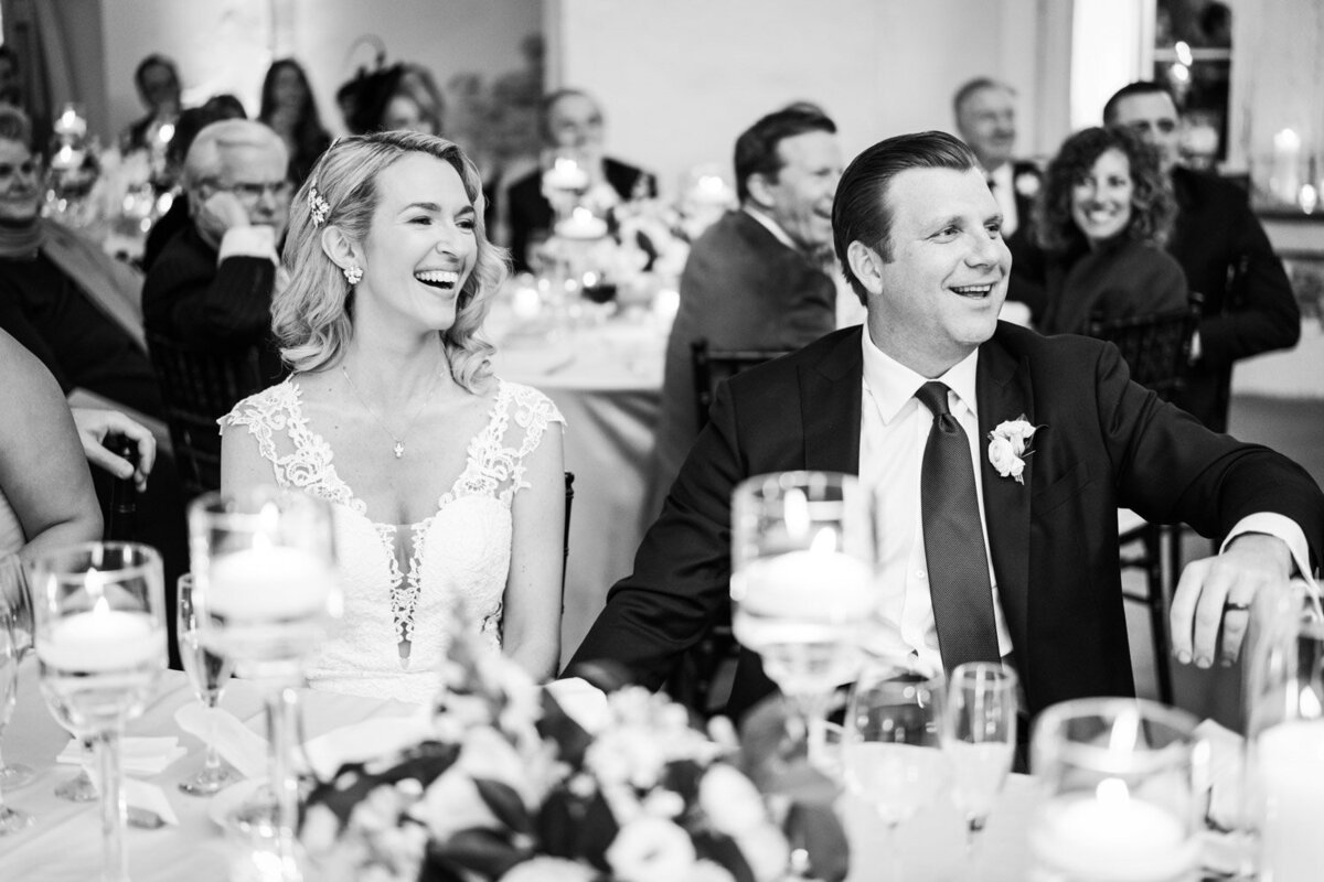 Couple laughs during toast at Latrobe's wedding
