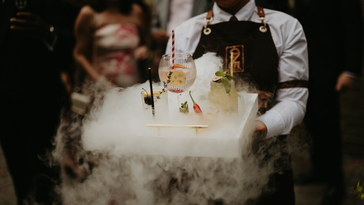 Smoking cocktails at a Jewish wedding The Brewery near The Barbican in London. 