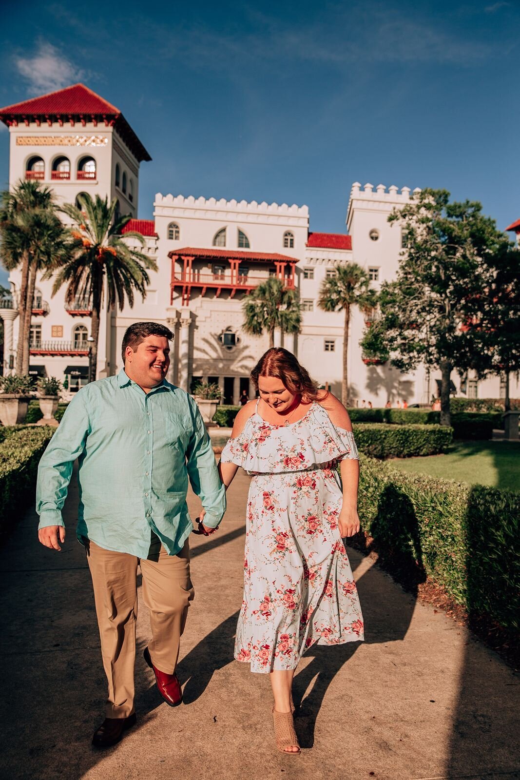 couple walking holding hands in historic st. augustine