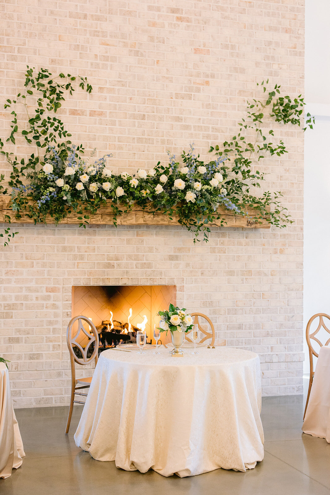 sweetheart table in front of fireplace
