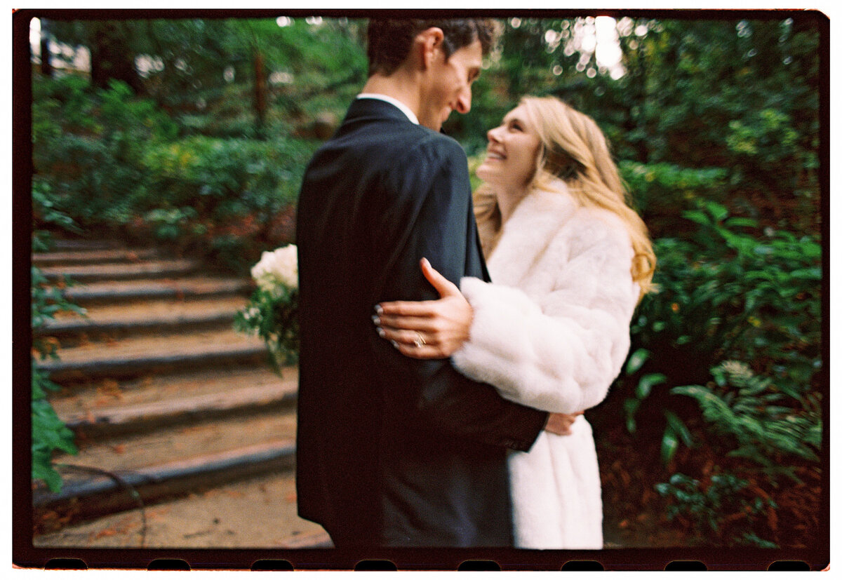 Bride and groom embracing during their Santa Cruz film wedding, captured by Kate Winters Photography.