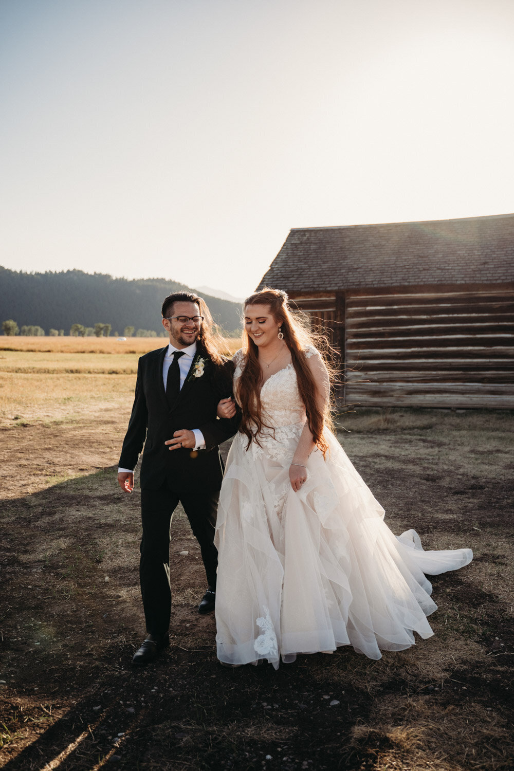 Bride and Groom walk at Mormon Row