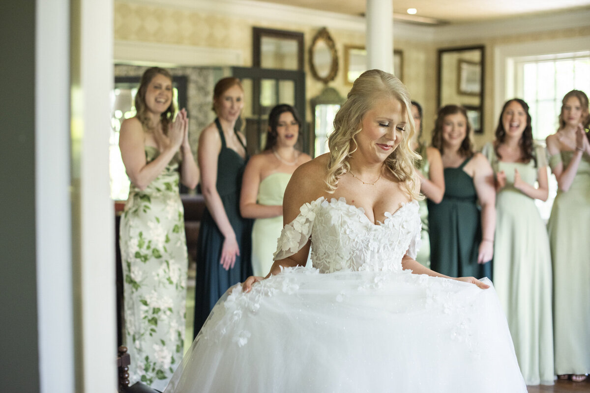 Bride and bridesmaids first look at wedding