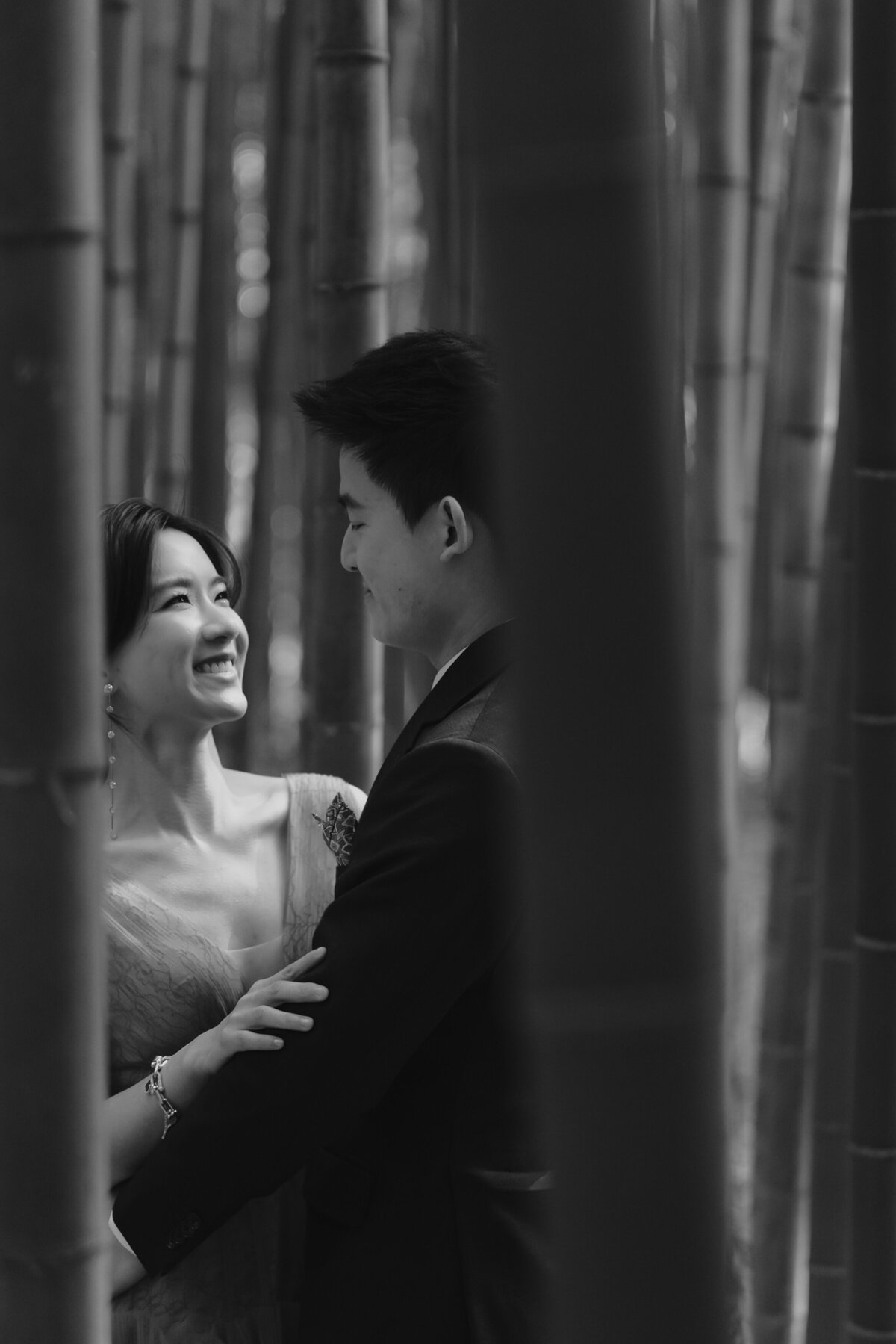 a couple smile at each other at Damyang Bamboo Forest during their pre-wedding shoot