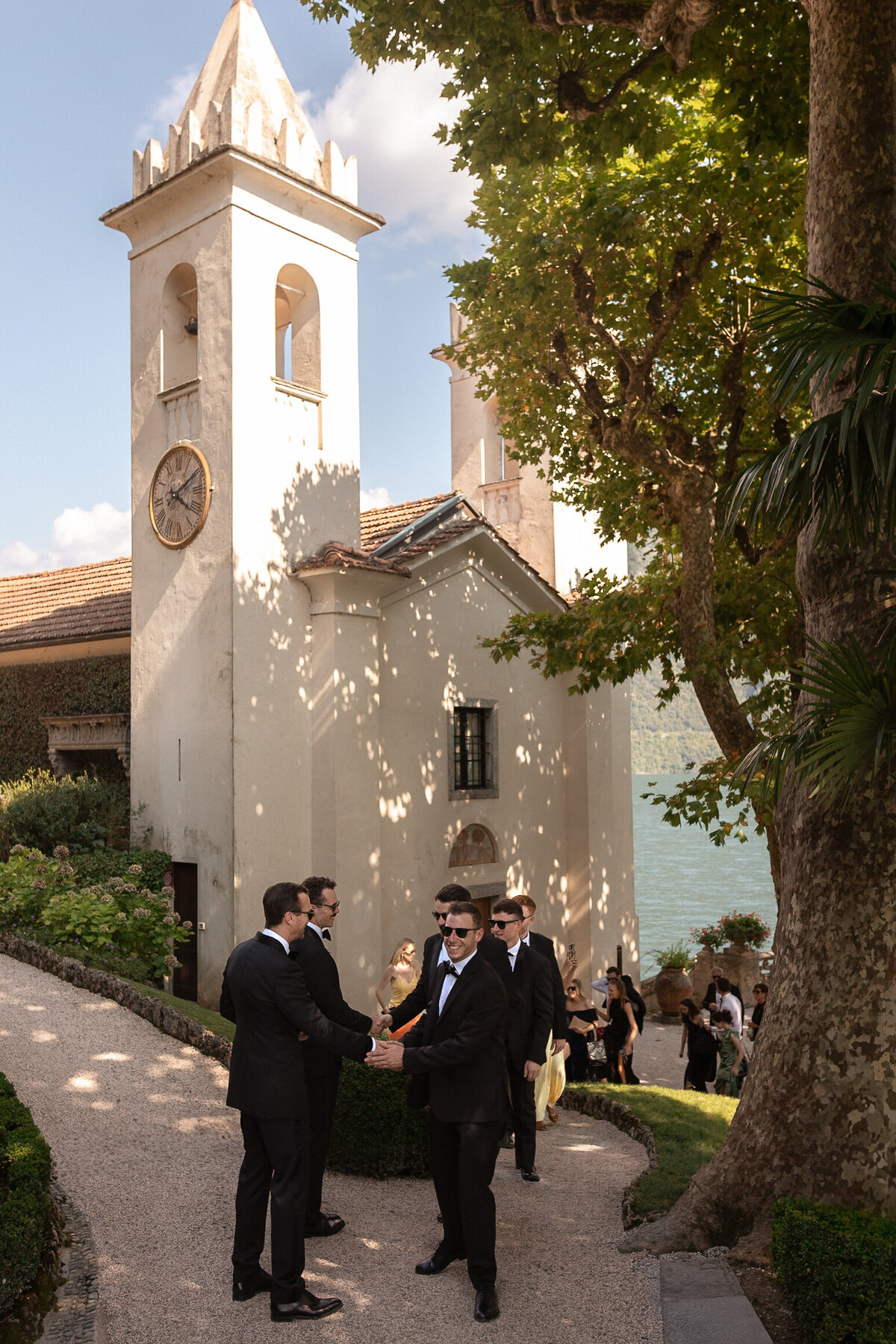 Wedding photographer captures couple taking a stroll hand in hand at their french chateau wedding.