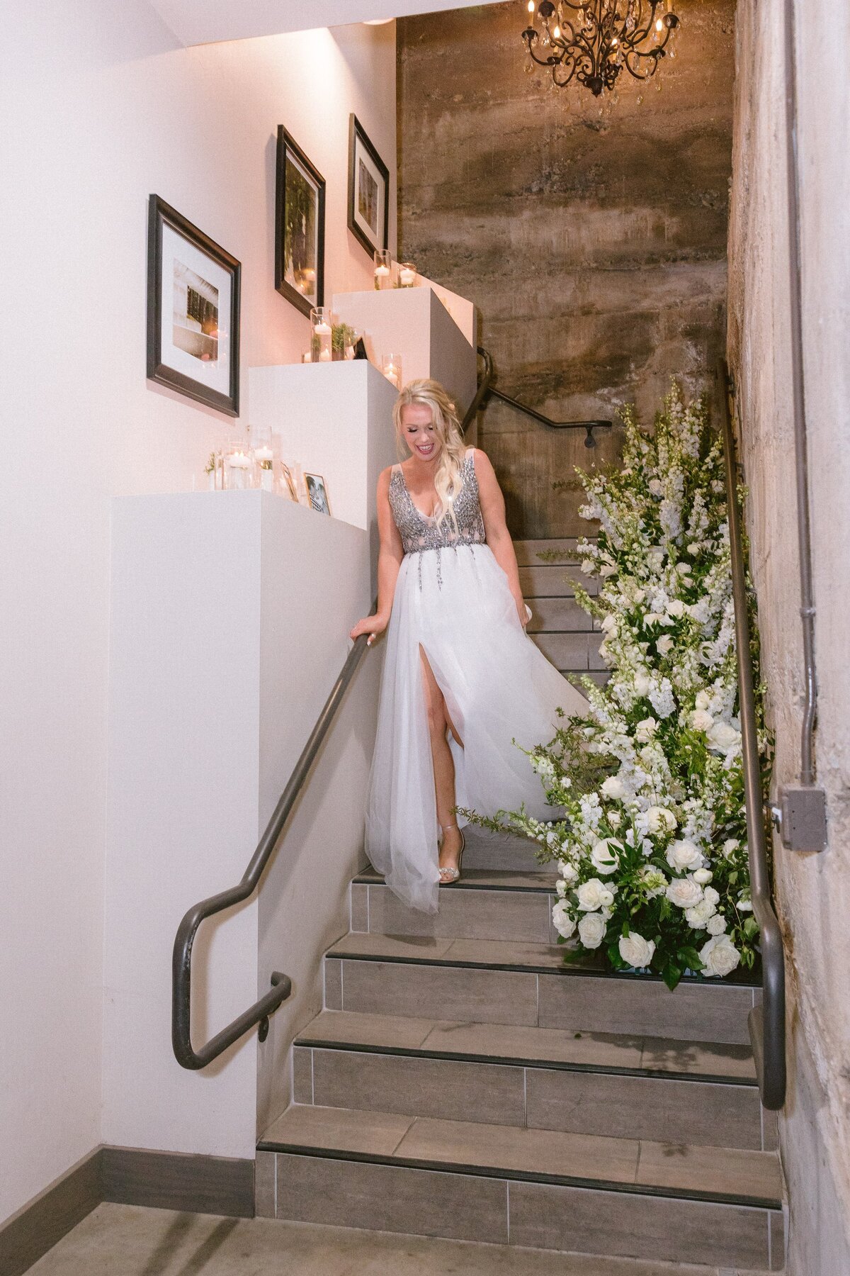 indoor staircase, repurposed flowers, long gown, white flowy dress