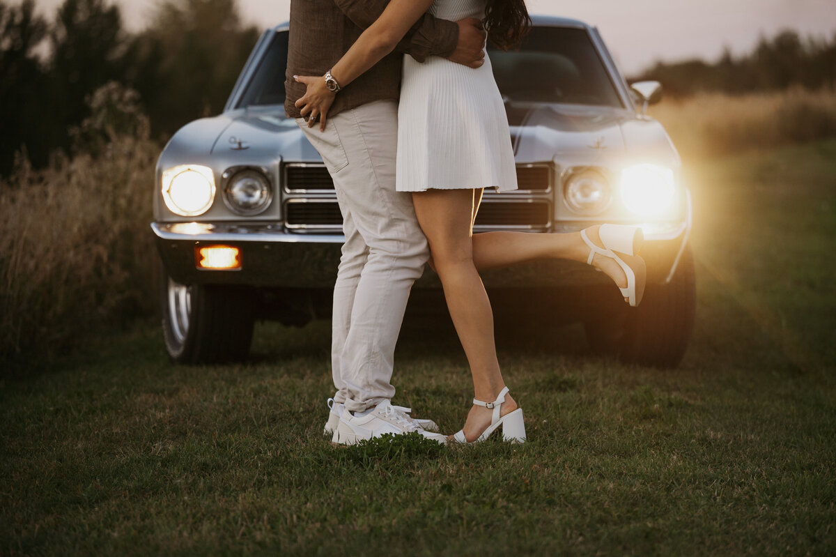 Photo of Edmonton couple standing infront of their car 