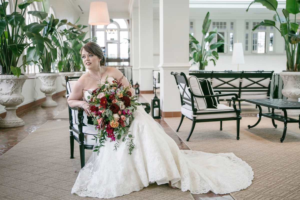 Bride sitting with her bouquet at The Lesner Inn