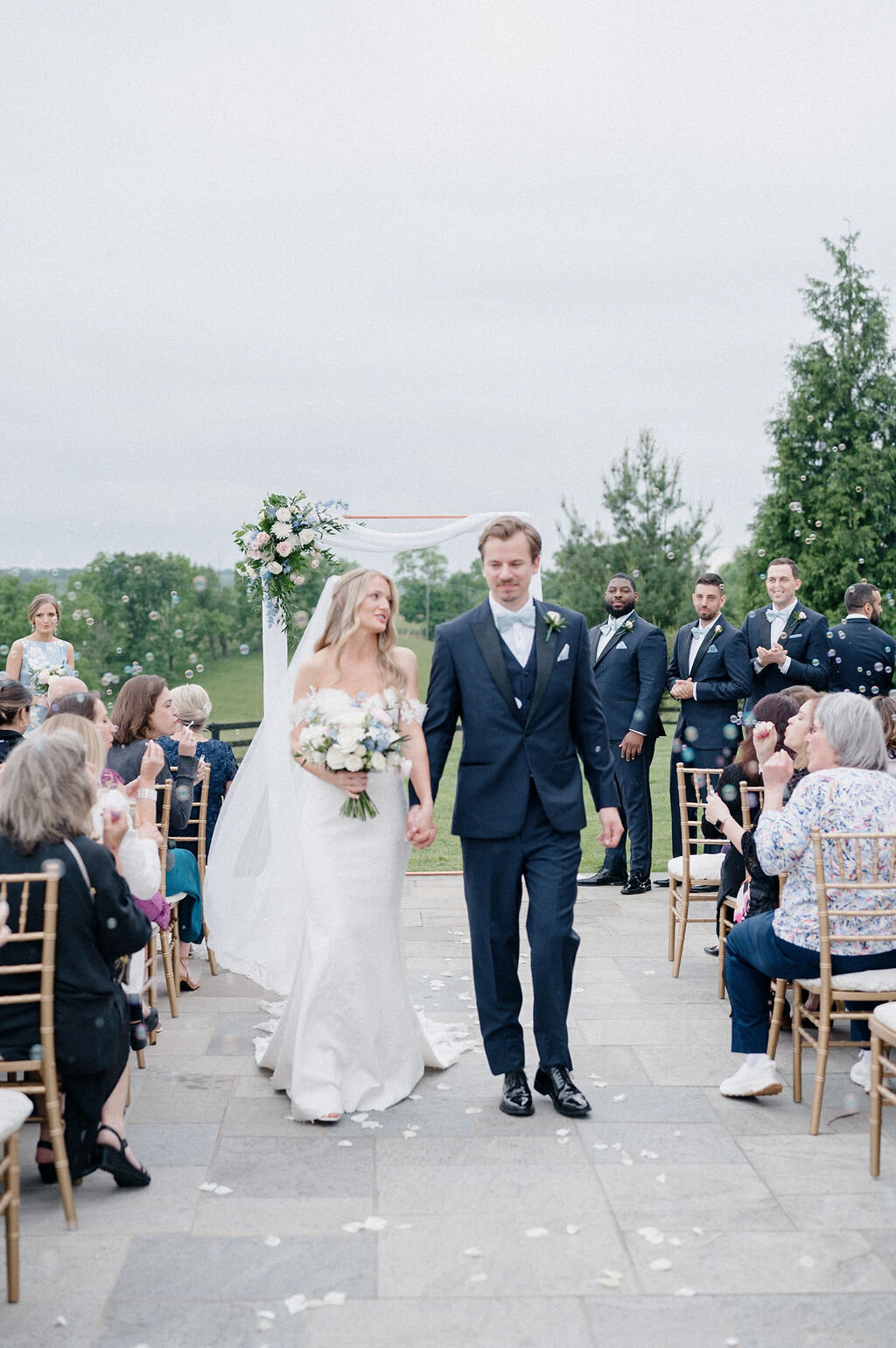 Bride and groom walking down the aisle 