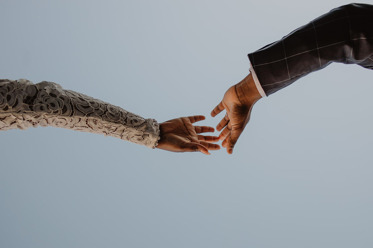 Two hands outstretched towards each other 