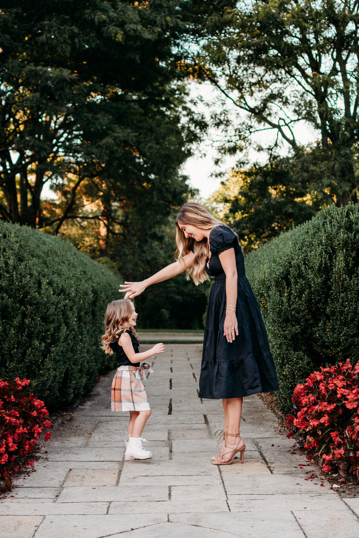 Candid photo of mom and daughter in Hurley Gardens, Wheaton, IL, by Moments by Meli