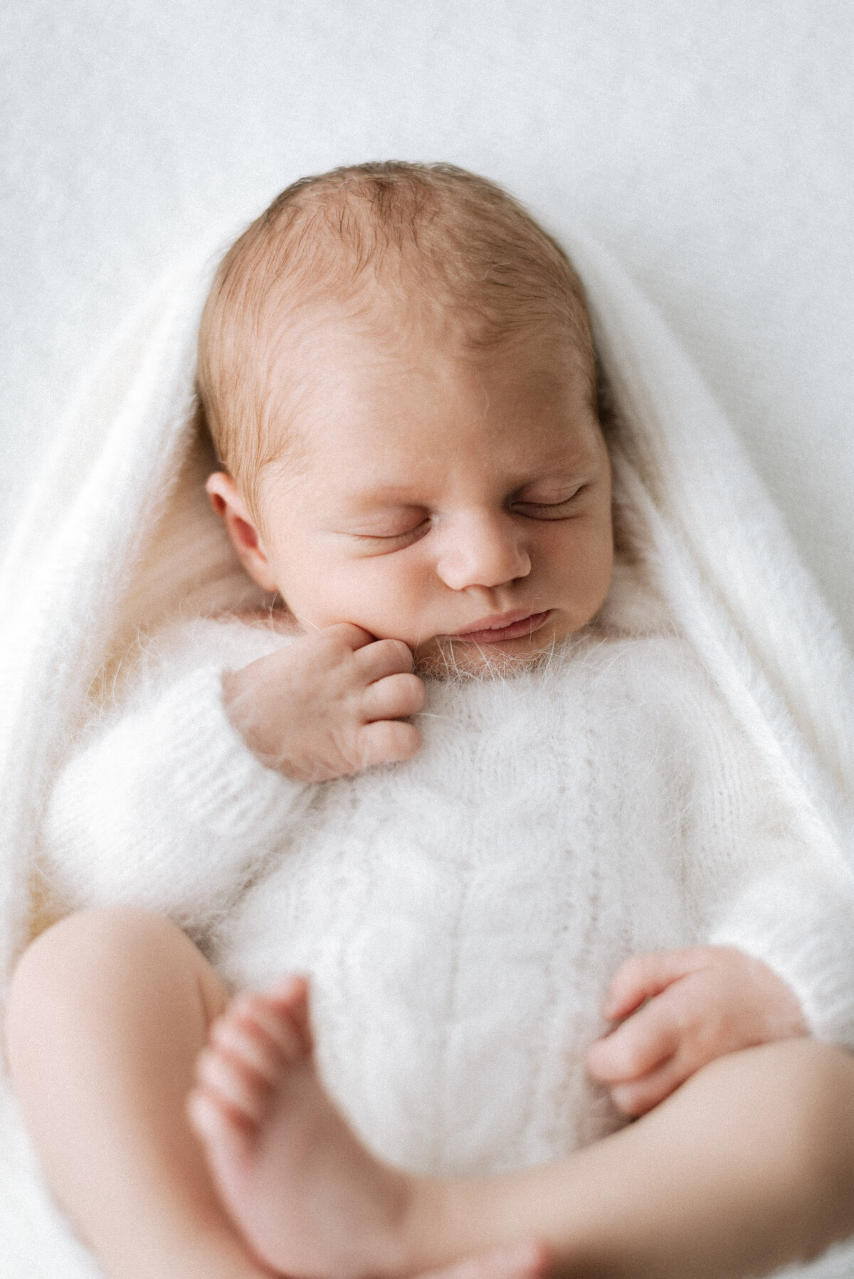 Baby girl sleeping at billingshurst newborn photoshoot