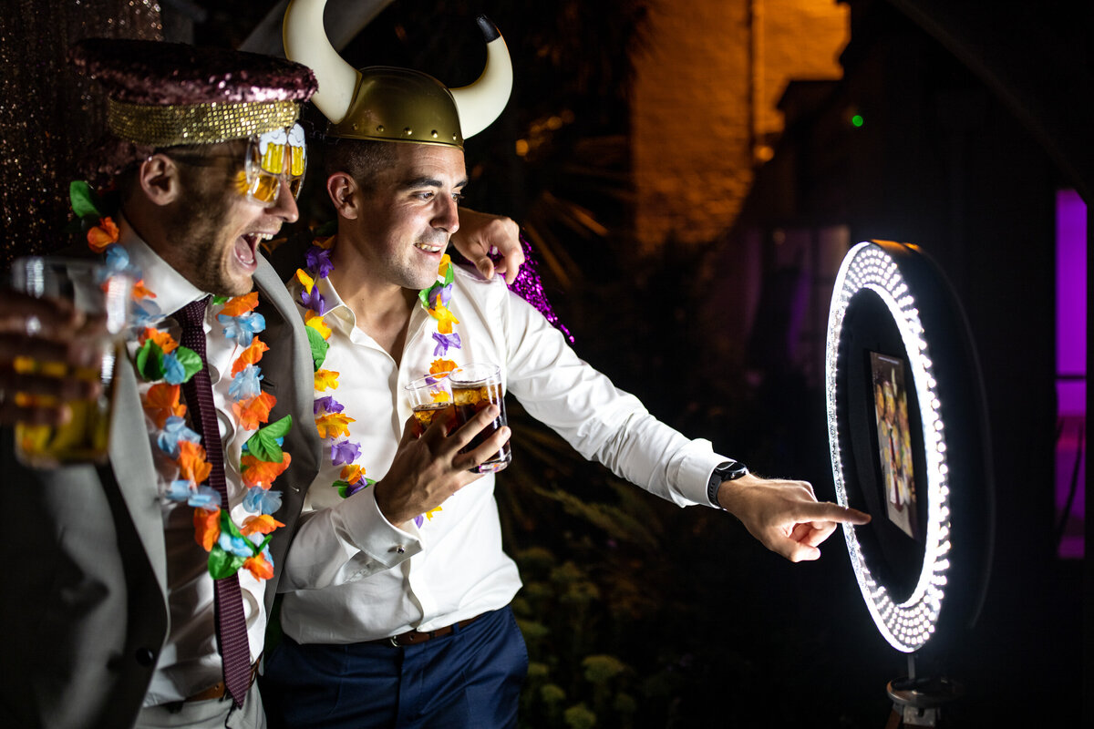 Wedding guests in costume taking photos