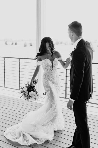 Groom looking at bride spinning to show planning a wedding in chicago
