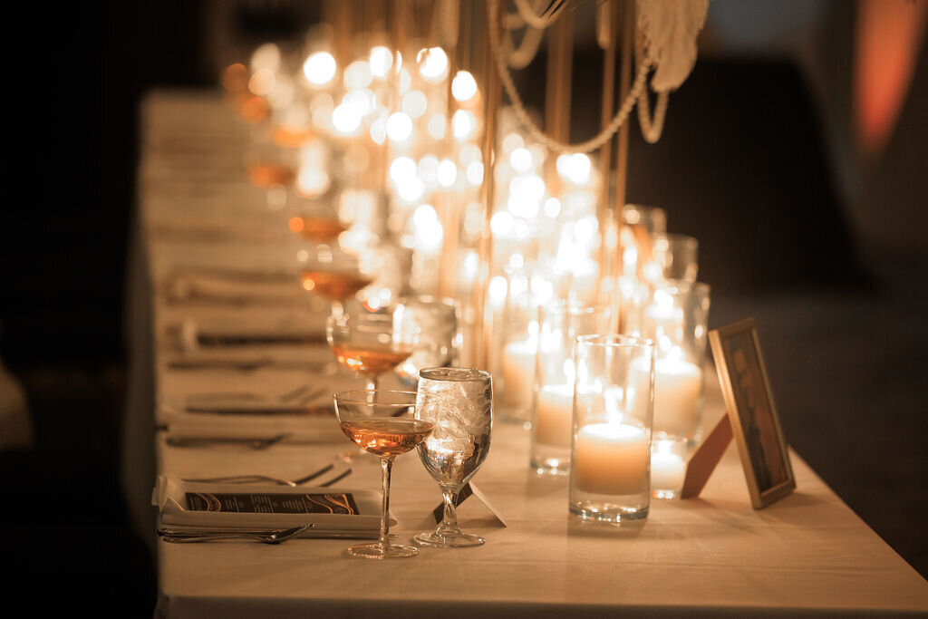 Champagne coupes & candlelight centerpiece for a Gatsby-themed Sweet 16 in NJ