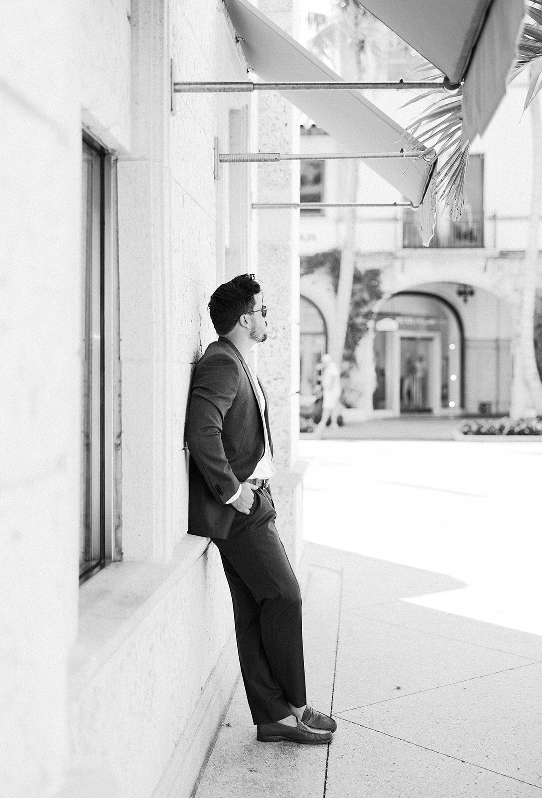 Garret at Worth Avenue, Palm Beach, during an elegant engagement session with Claudia Amalia Photography.
