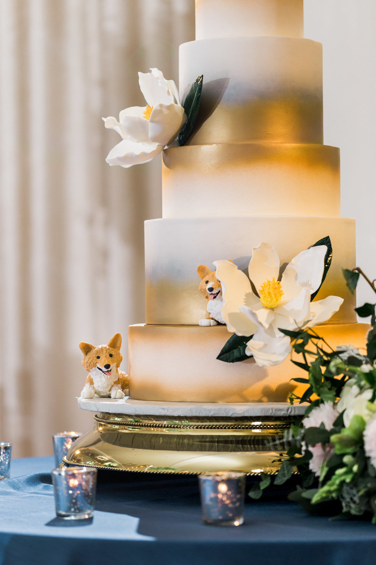 This bride chose to incorporate her love of Corgis's into her wedding cake. Photo by luxury destination wedding photographer Rebecca Cerasani.