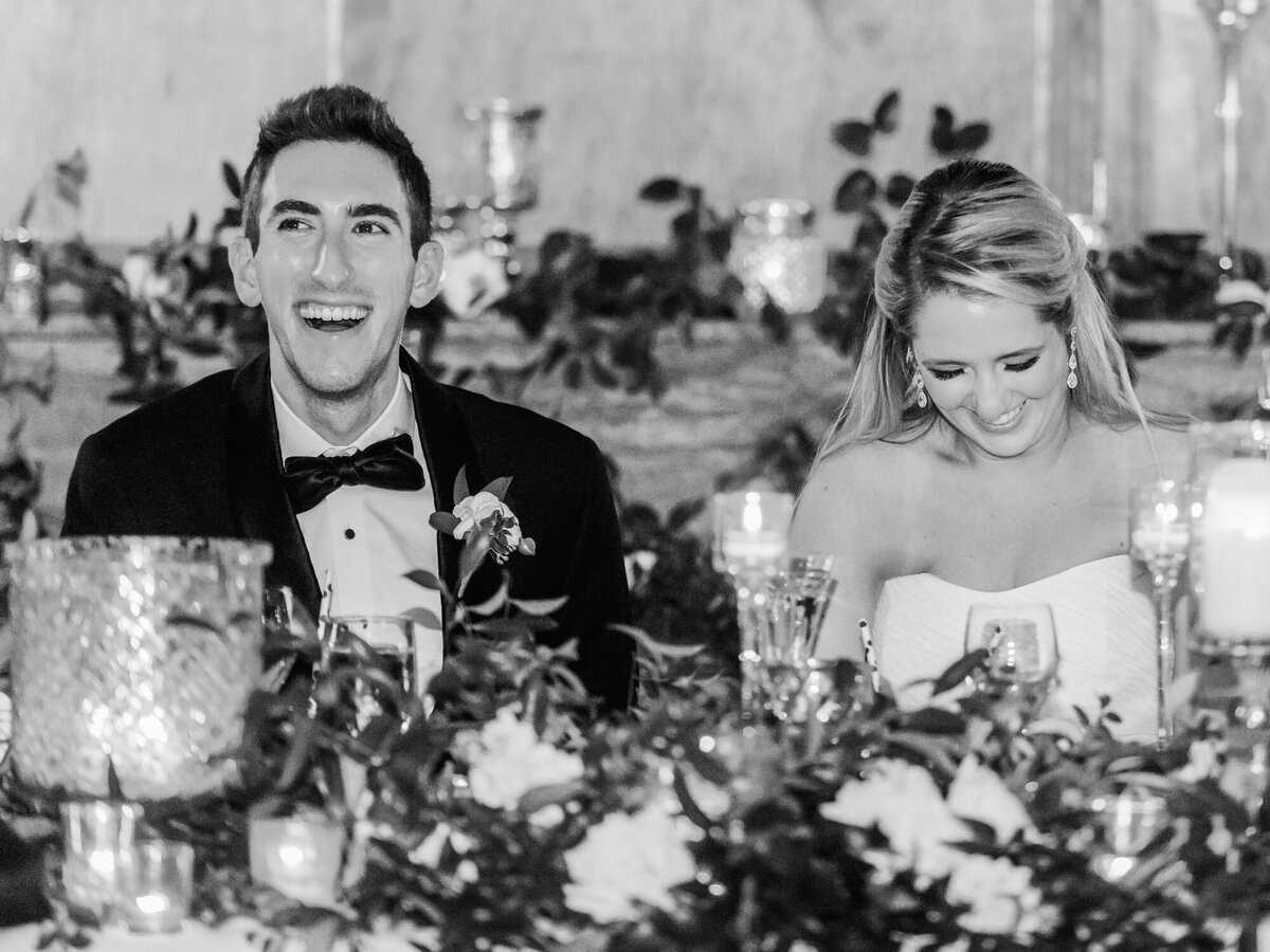 A black and white candid photograph from a wedding reception at Cafe Brauer in Chicago