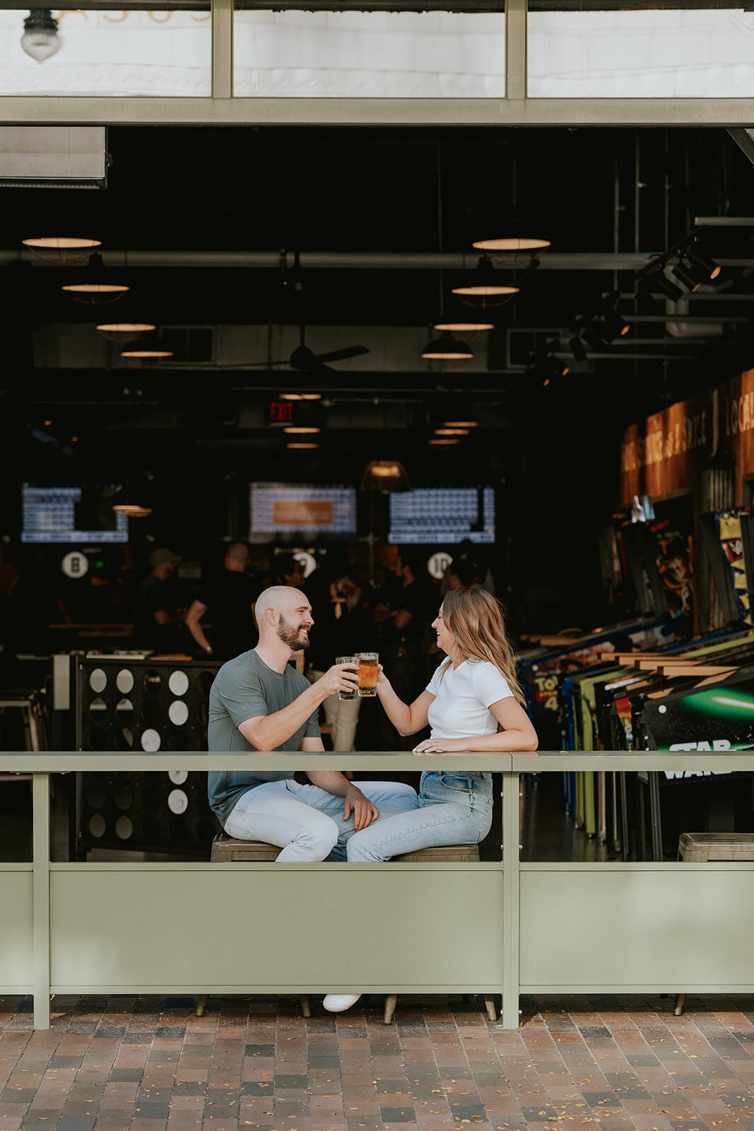 Candid Indianapolis engagement photography bar session