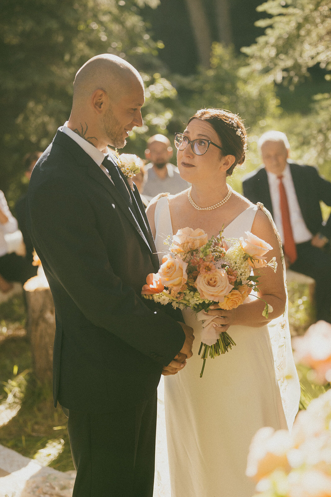 bridge and groom on wedding day holding bouquet