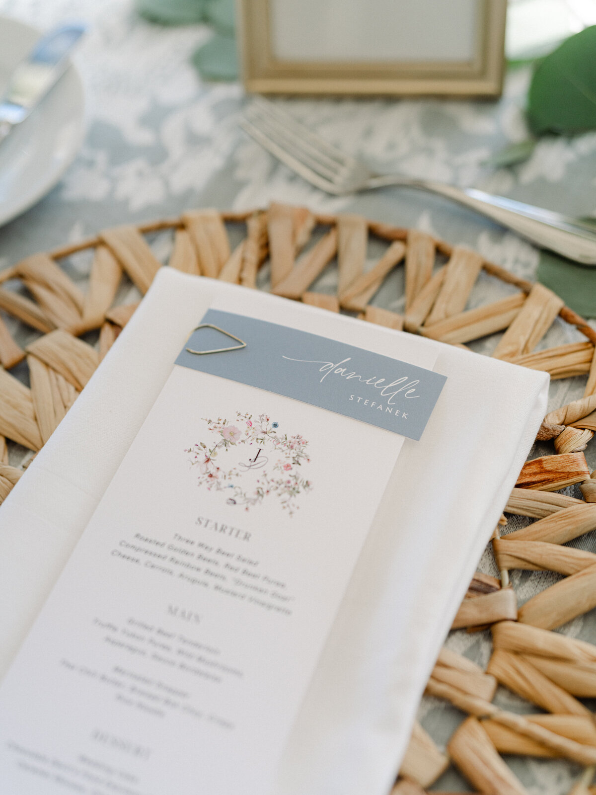 Detail photo of wedding menu card on placemat