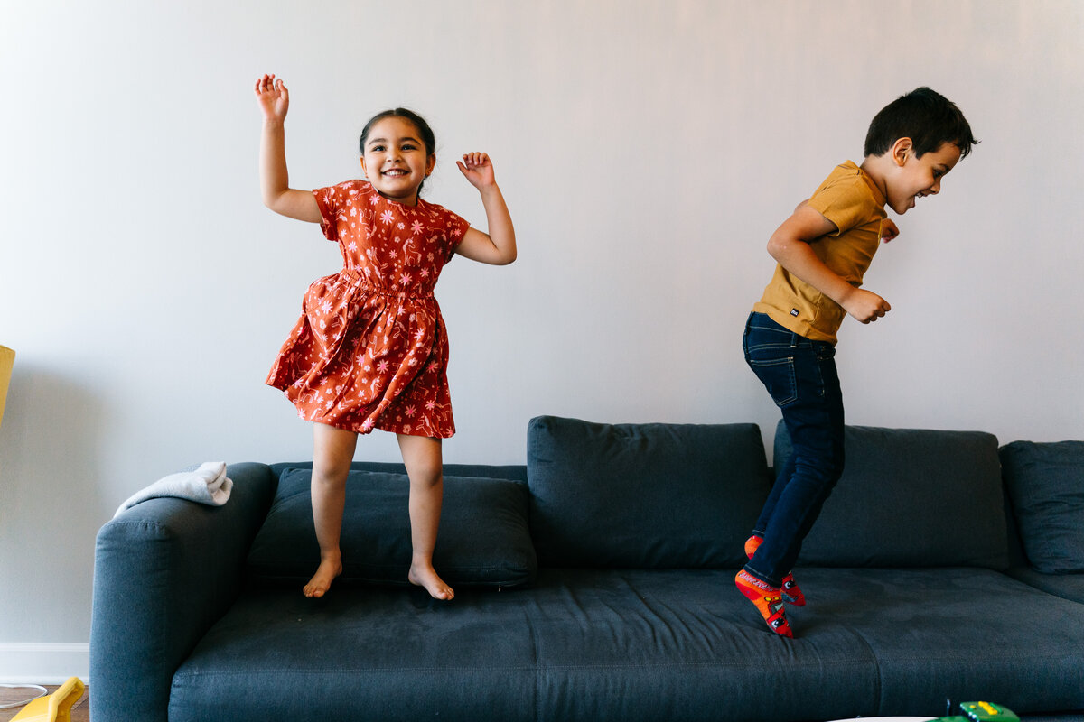 Family Photography Session: Children jumping on a couch