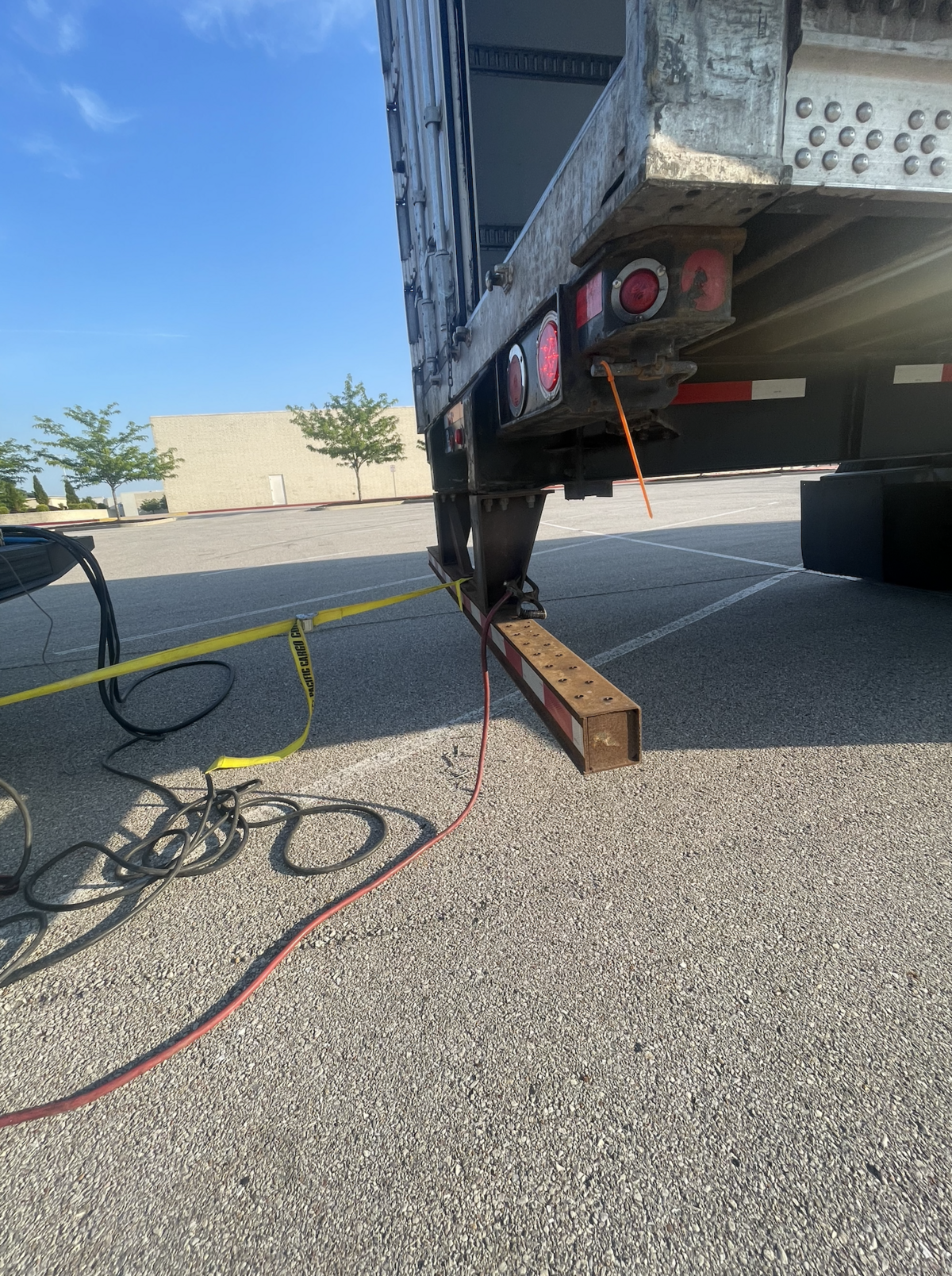 On-site welding and steel reinforcement work performed on a commercial trailer to repair and strengthen its structure.