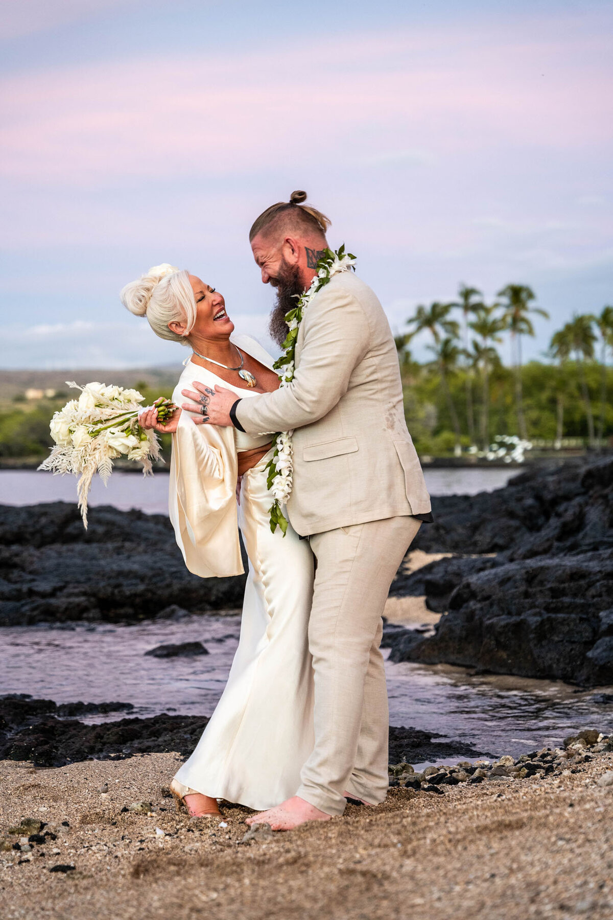 Couple dancing on beach for wedding photography big island hawaii