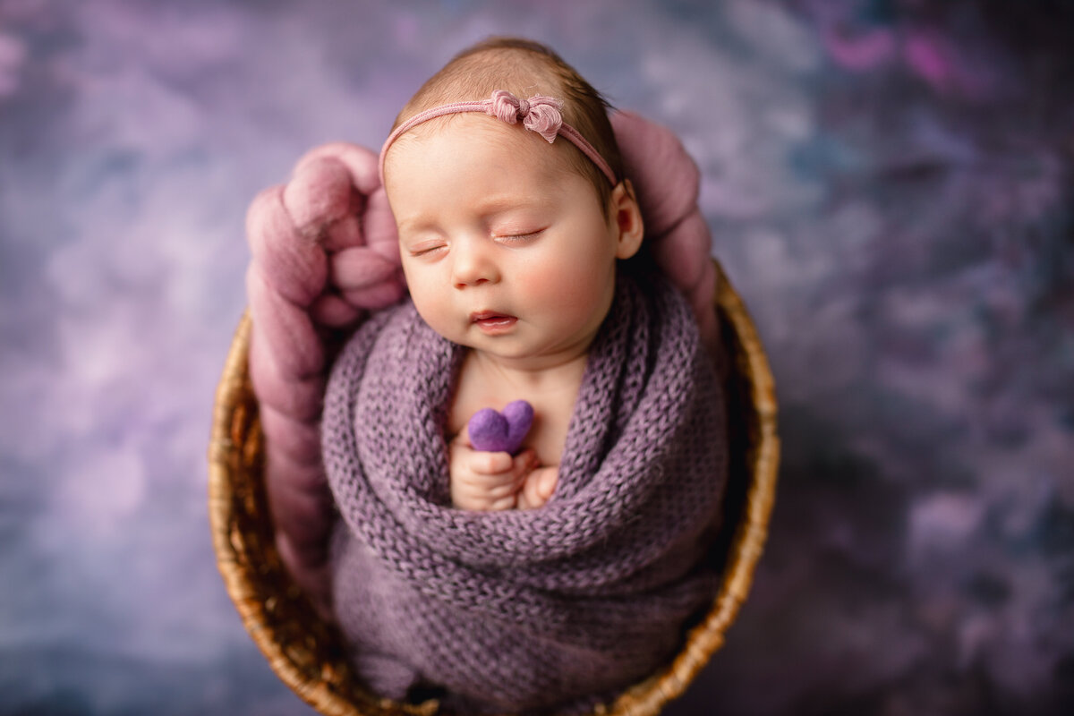 baby in basket purples