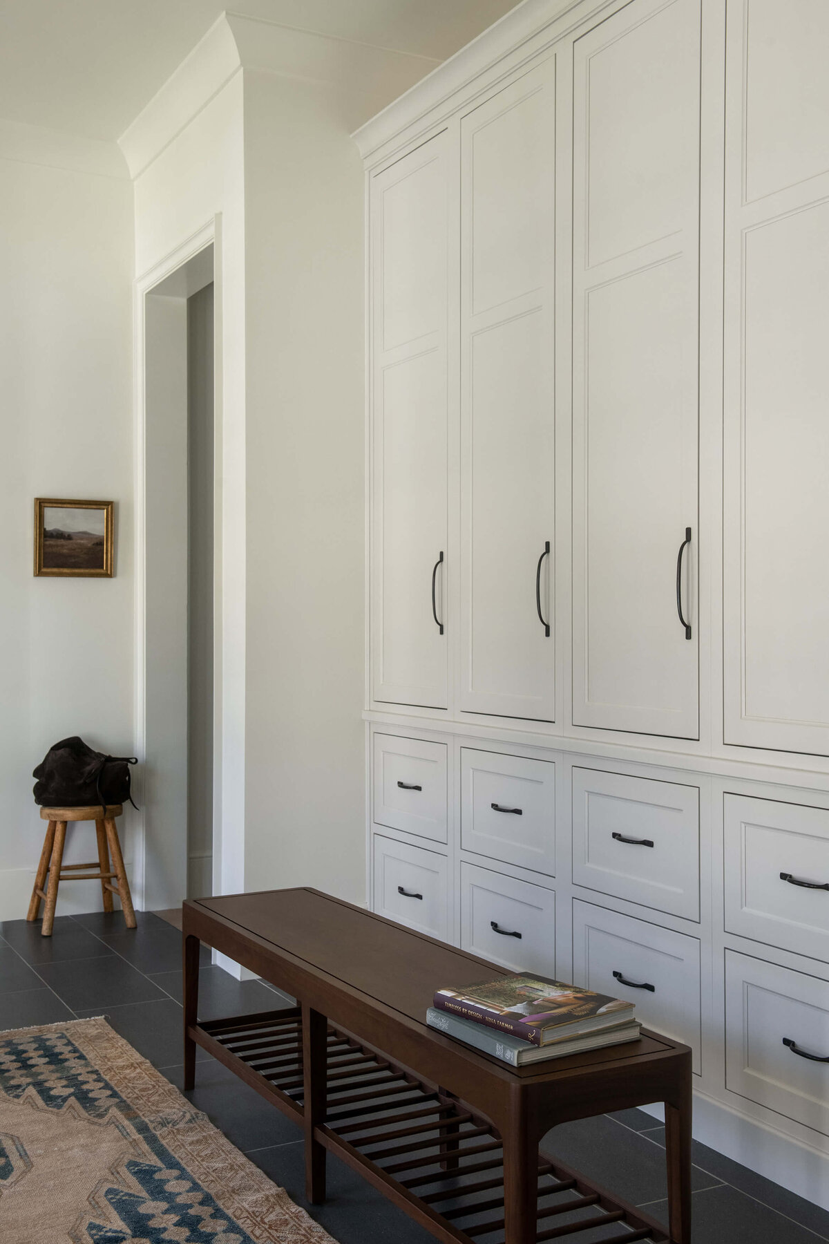 dutch-tudor-mudroom-white-cabinets-black-hardware