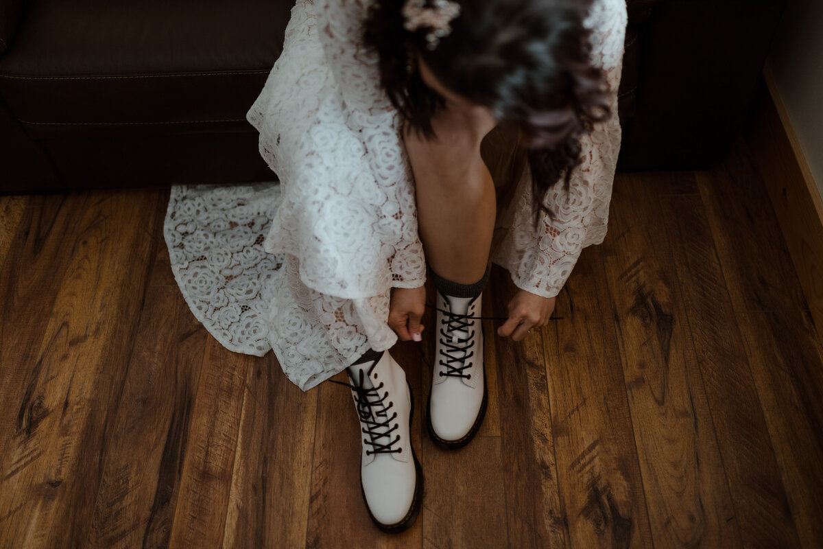 bride putting on boots