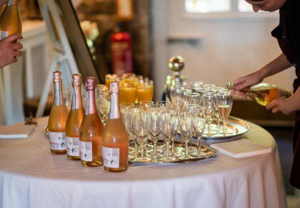 A table topped with lots of bottles of wine