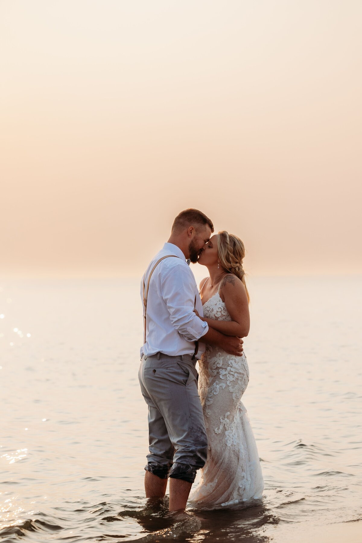 bride-and-groom-kissing-in-lake-michigan