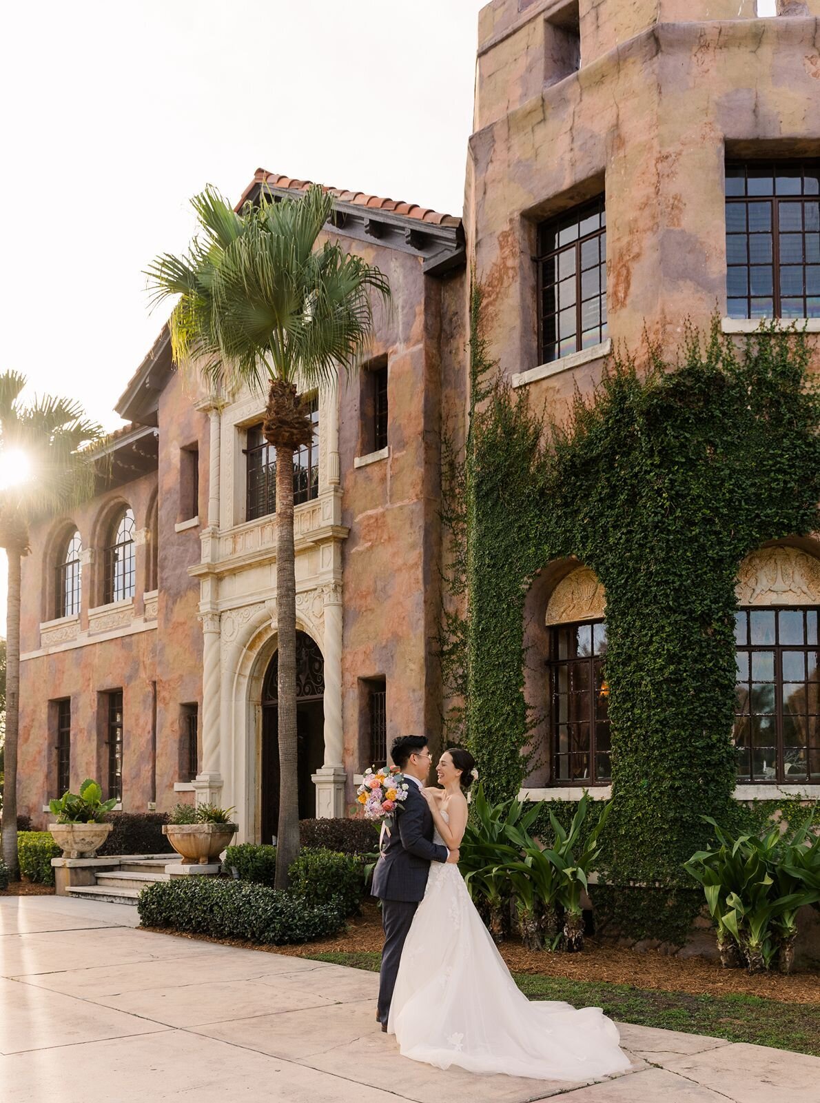 bride and groom at howey mansion during sunset
