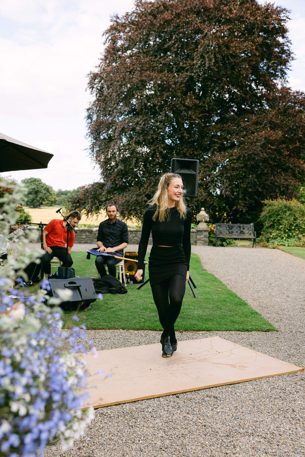 A wedding photo of a traditional irish dancer dancing during a wedding at Luttrellstown Castle